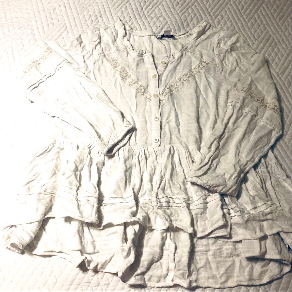 Medium. White flirty blouse. Dress up dress down with jeans